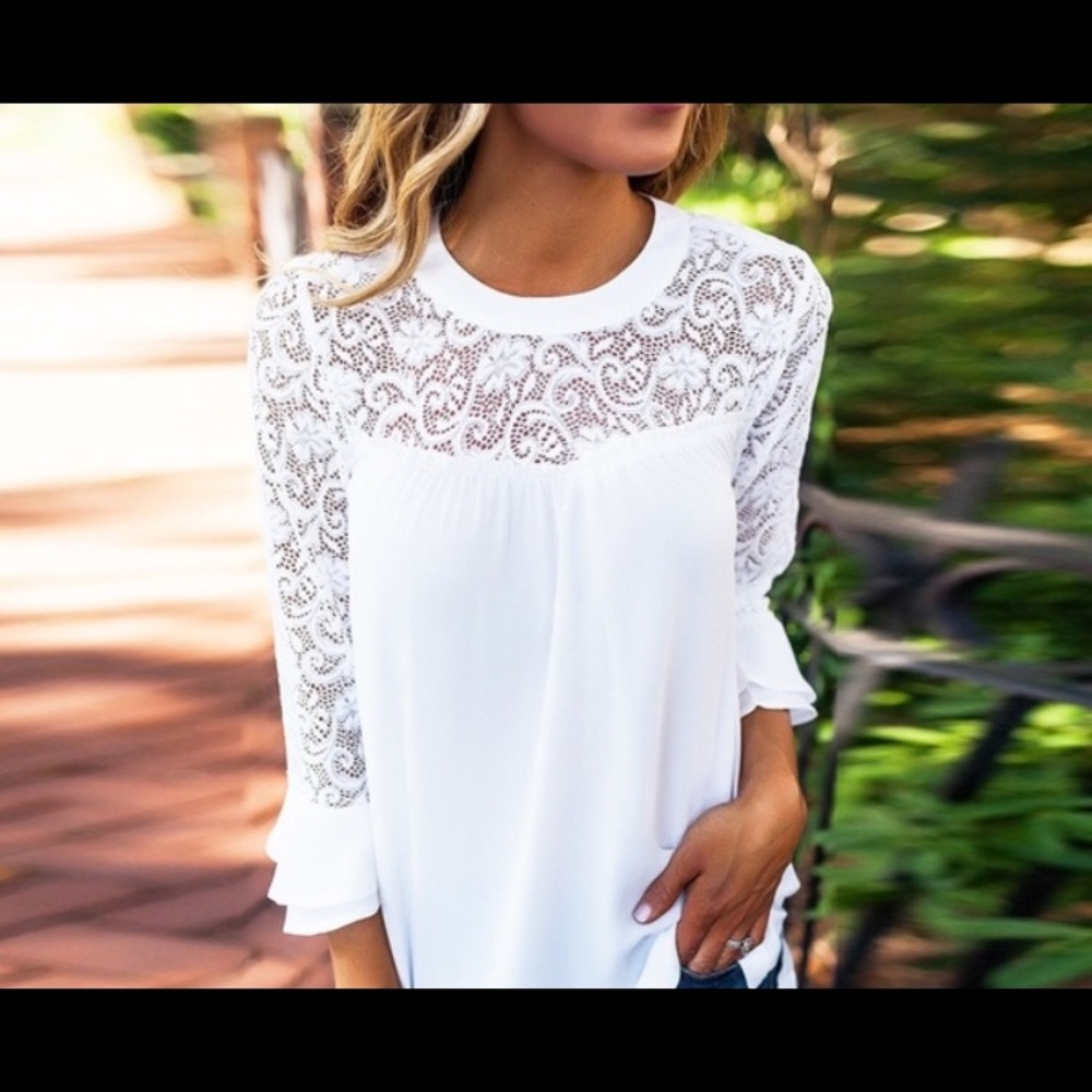 White blouse with lace and bell sleeves